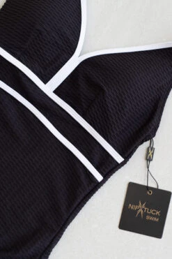 Black Aphrodite Audrey One Piece Swimsuit - Final Sale -Bikini Confidence NN1137YAPK APHRODITE ONE PIECE SWIMSUIT NIP TUCK SWIM FLATLAY 1